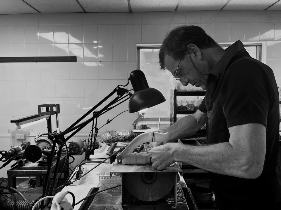An Affa Jewels artisan hand-finishing a piece at the workbench